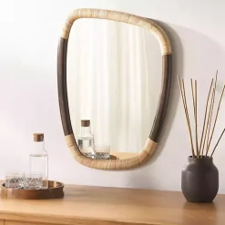 Kirklands Home Dark Wood and Natural Cane Abstract Wall Mirror