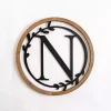 Kirklands Home Wood and Metal Laurel N Plaque